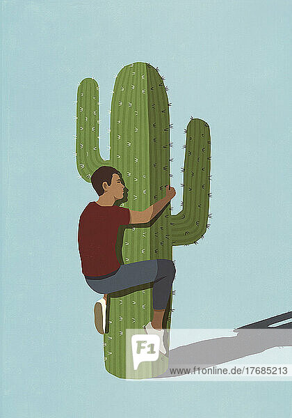 Man hugging spiky cactus