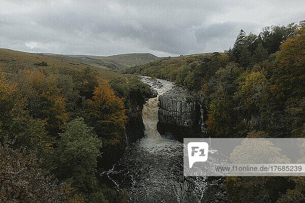 Waterfall over rocks in remote  autumn landscape  High Force Waterfall  Durham  England