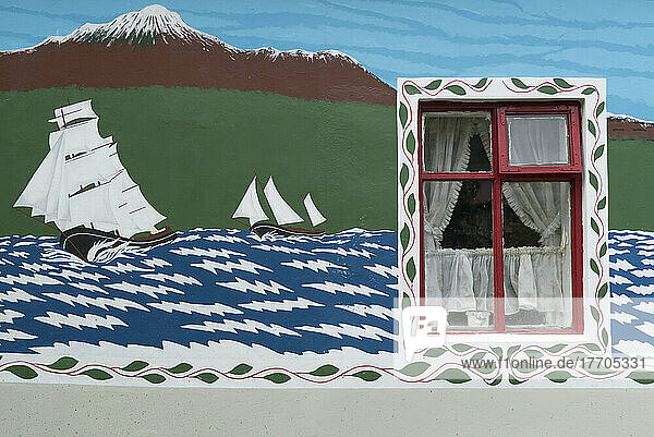 Painted wall on a home in Seyoisfjordour  a former fishing town that is now a tourist destination; Seyoisfjorour  Iceland