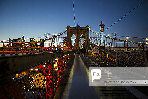 Pedestrian Path On Brooklyn Bridge Heading Into Manhattan At Night; New York City  New York  United States Of America