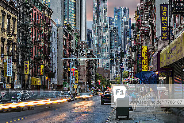 Contrast of old and new architecture at twilight on Madison Street in Chinatown in New York City; New York City  New York  United States of America