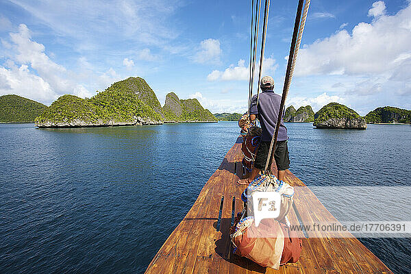 Pulau Wayag Islands With Tiger Blue Phinisi Schooner Sailing Through Raja Ampat; Indonesia