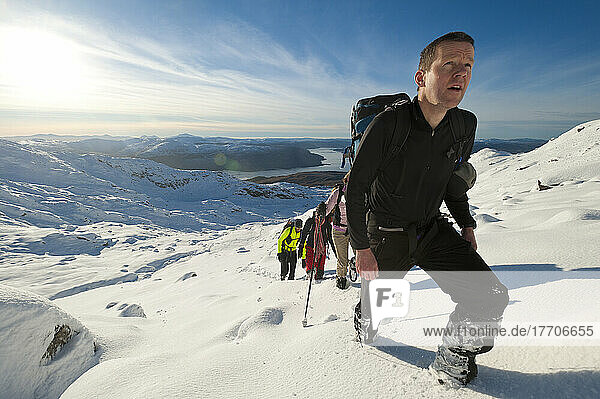 Walkers Going Through Heavy Snow Up Beinn Respiol  Ardnamurchan Peninsula  Highlands  Scotland