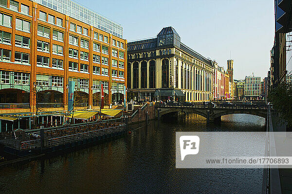 A Road Bridge Crossing The River And Buildings Along The River; Hamburg  Germany