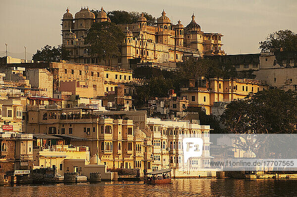 Buildings Glowing In The Sunlight Of The Setting Sun Along The River; Udaipur  India
