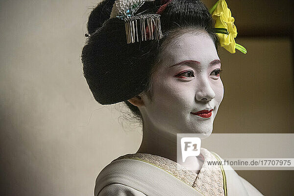 Portrait of a Maiko  an apprentice geisha in Kyoto and Western Japan. Their jobs consist of performing songs  dances  and playing the shamisen or other traditional Japanese instruments for visitors during banquets and parties  Maiko are usually aged between 17 to 20 years old  and graduate to geisha status after a period of training. This apprenticeship usually ranges from a period of a few months to a year or two years  though apprentices too old to dress as maiko may instead skip to the stage of geisha  despite still being in training; Kyoto  Japan