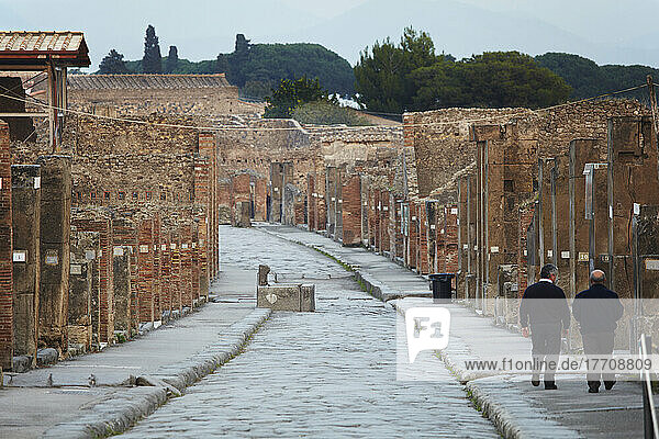 Via dell Abbondariza  the main street through Pompeii  near Naples  Italy; Pompeii  Campania  Italy
