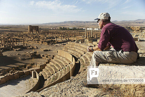Tourist Surveys The Theatre And Roman Ruins  Timgad  Near Batna; Algeria