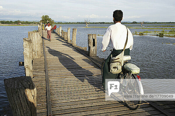 Cyclist Goes Across U Bein Bridge  Made Of Teak Wood; Mandaly  Burma