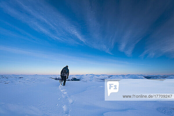 Walker On The Summit Of Beinn Respiol At Dusk  Ardnamurchan Peninsula; Highlands  Scotland
