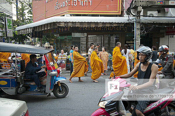 A Group Of Buddhist Monks On Their Morning Alms Round; Bangkok  Thailand