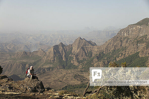 Trekker Resting At Viewpoint  Simien Mountains National Park; Amhara Region  Ethiopia
