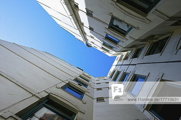 Low Angle View Of A White Building With Windows And Walls On Five Sides And A Blue Sky; Hamburg  Deutschland