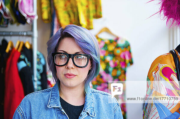 A Woman With Purple Hair And Bold Eyeglasses Shops At Portobello Market  Notting Hill; London  England