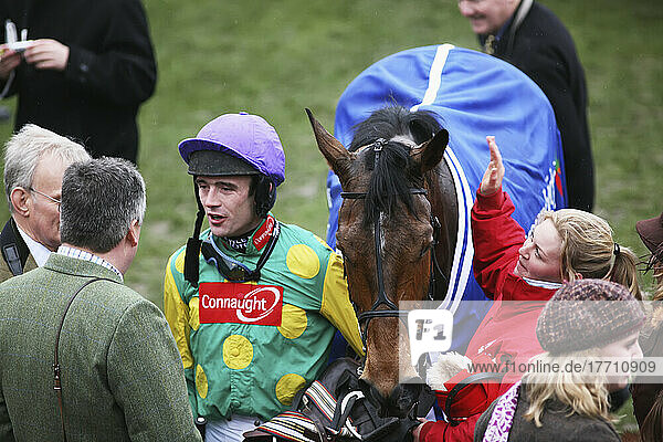 A Jockey With The Champion Trainer After Winning The Champion Chase Horse Race; Cheltenham  Gloucestershire  England