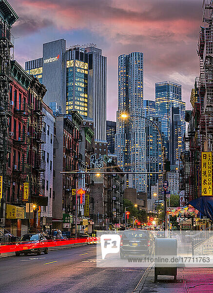 Contrast of old and new architecture at twilight on Madison Street in Chinatown in New York City; New York City  New York  United States of America