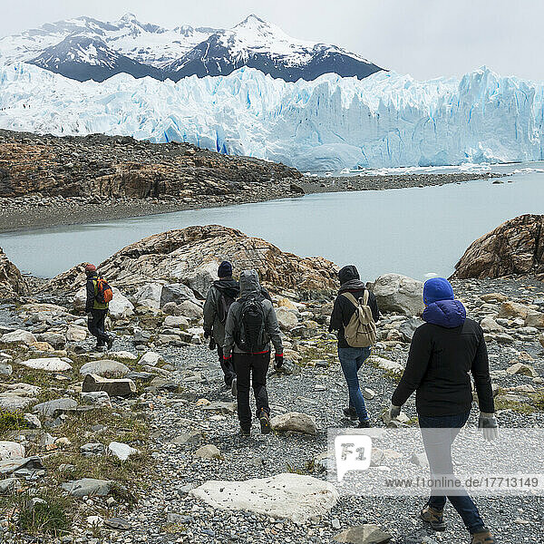 Tourists Walk By Lake Argentino And Moreno Glacier  Los Glaciares National Park; Santa Cruz Province  Argentina