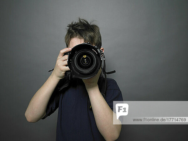 Young Boy Using Camera