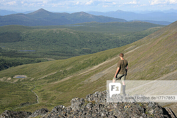 Hiker On Top Of Caribou Mountain Looking North Up Carcross Highway Valley  Yukon