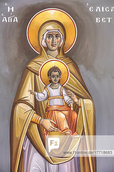 Nahaufnahme eines farbenfrohen religiösen Freskos der Jungfrau Maria  die Jesus in der Heiligen Kirche von St. Nicholas in Koukaki hält; Athen  Griechenland
