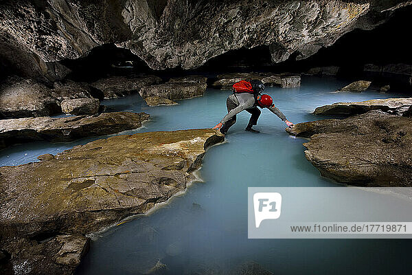 A photo assistant crosses sulphurous water in Cueva de Villa Luz in Tabasco  Mexico.