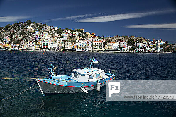 Fishing boat moored in Gialos Harbor  Symi (Simi) Island; Dodecanese Island Group  Greece
