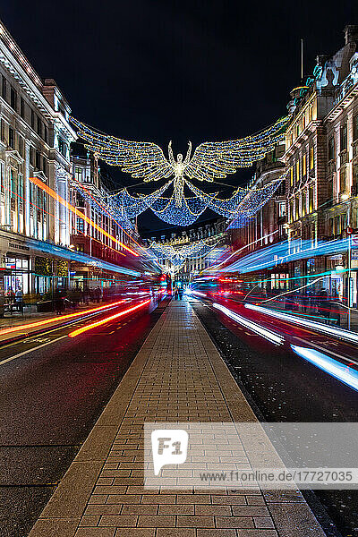 Christmas decorations in Regent Street with light trails  London  England  United Kingdom  Europe