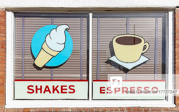 Signs for SHAKES and ESPRESSO  retro style signs on a cafe window.