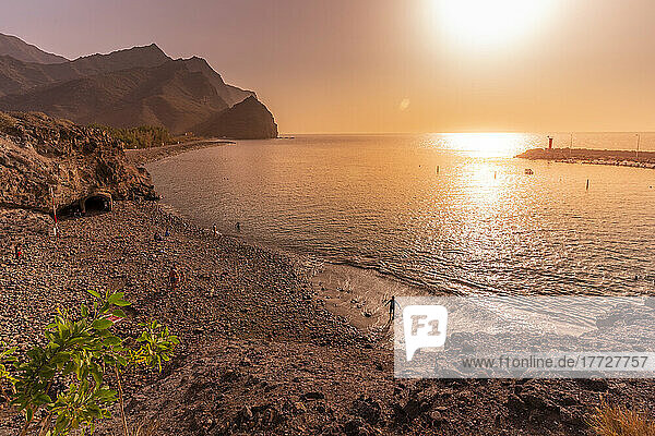 View of beach and coastline with mountains in background during golden hour  Puerto de La Aldea  Gran Canaria  Canary Islands  Spain  Atlantic  Europe