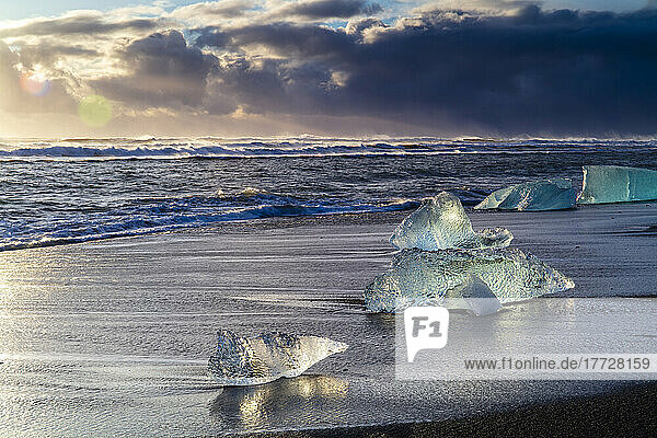 Icebergs from melting glacier on black sand beach near Jokulsarlon glacier lagoon  Vatnajokull National Park  Iceland  Polar Regions