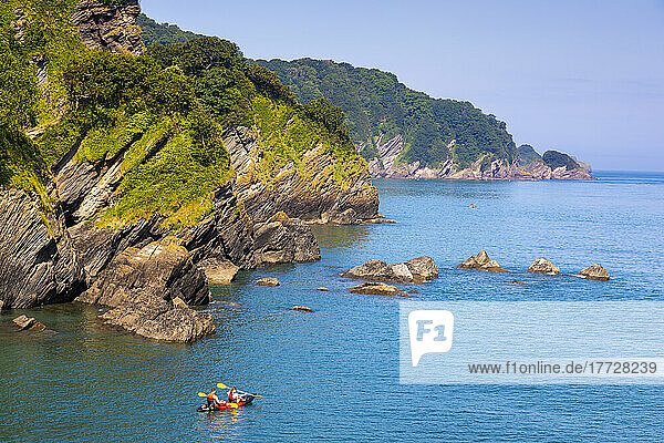 Kayakers and coastal view  Combe Martin  Exmoor National Park  North Devon  England  United Kingdom  Europe