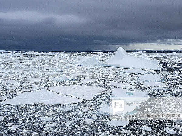 Stormy weather over pack ice and icebergs near Adelaide Island  Antarctica  Polar Regions
