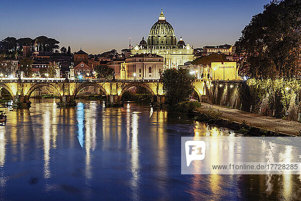 Night view of San Angelo Bridge on River Tiber with background of illuminated St. Peter's Basilica in the Vatican  Rome  Lazio  Italy  Europe