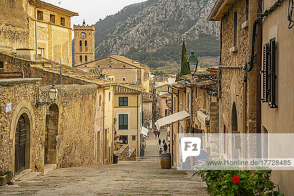 View of church clock tower and street in the old town of Pollenca  Pollenca  Majorca  Balearic Islands  Spain  Mediterranean  Europe