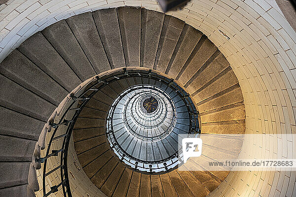 Spiral staircase from below in the Eckmuhl Lighthouse in Brittany  France  Europe