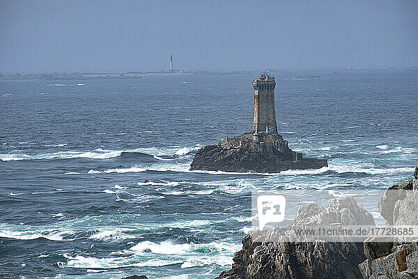 La Vieille lighthouse on a lonely rock in the water at Pointe du Raz  Finistere  Brittany  France  Europe