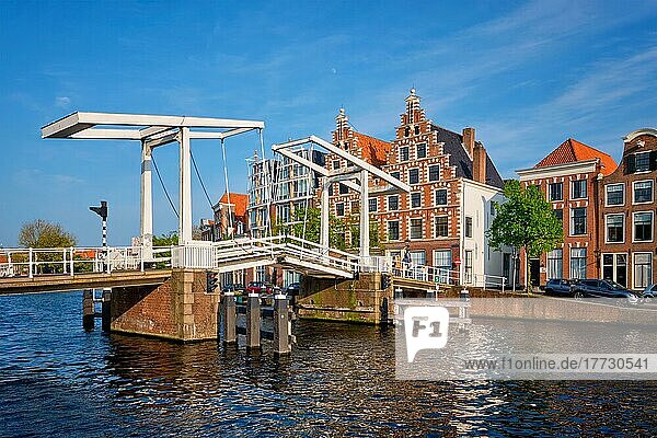 Gravestenenbrug bridge on Spaarne river and old houses in Haarlem  Netherlands