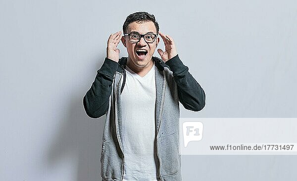 Surprised people opening his mouth  Surprised people with dumbfounded face on isolated background  astonished man holding his head
