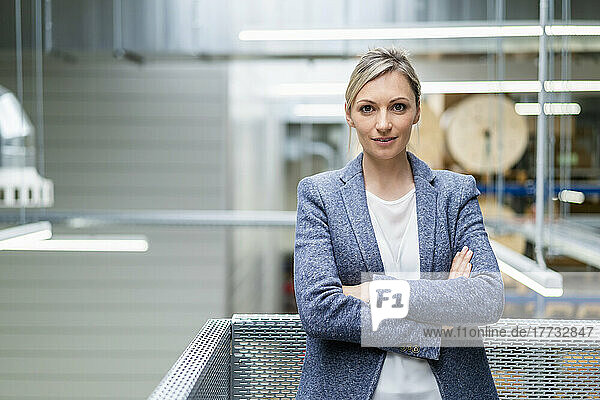 Portrait of confident businesswoman in factory