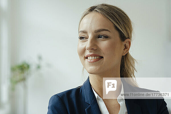 Smiling beautiful businesswoman with blond hair at office