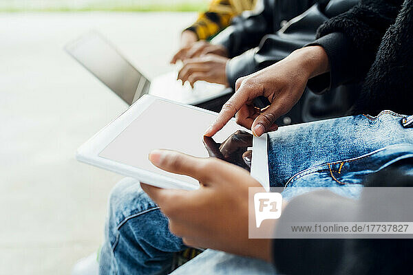 Hands of man using tablet PC