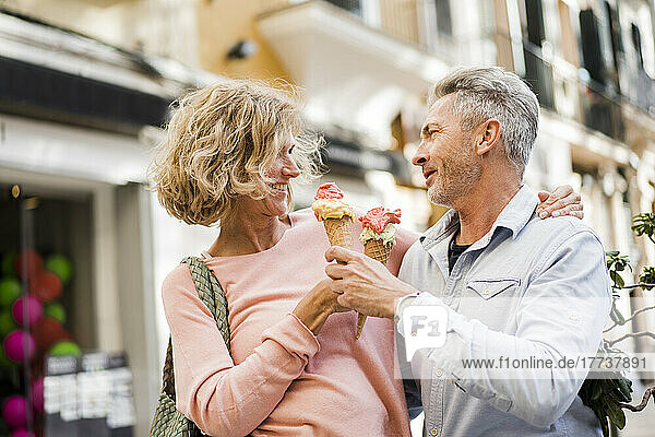 Smiling couple with ice cream cones