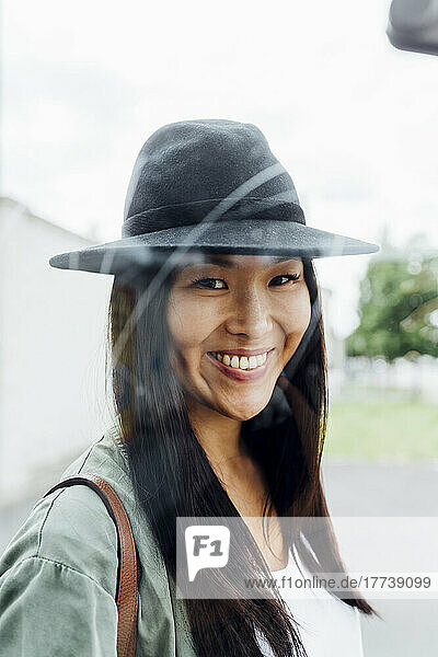 Smiling beautiful young woman wearing hat