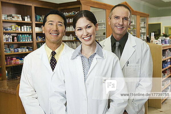 Portrait of three pharmacists in pharmacy