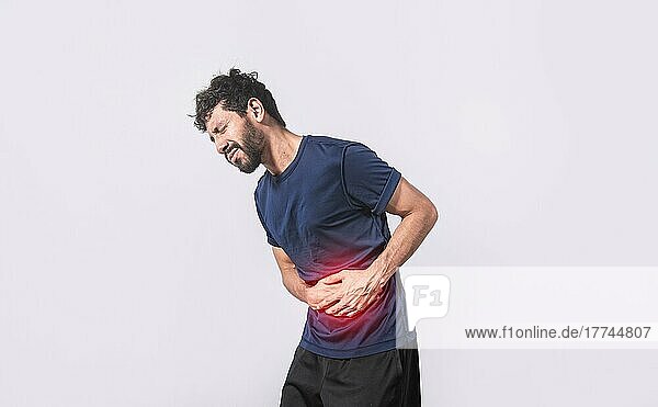Person with stomach pain  stomach problems concept  man with digestive problems  man with stomach pain  isolated