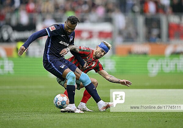 Kevin-Prince Boateng Hertha BSC Berlin (27) tackles Niklas Dorsch FC Augsburg FCA (30) with head bandage after head injury  WWK Arena  Augsburg  Bayern  Germany  Europe