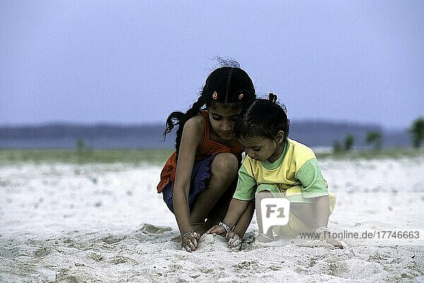 Children playing on the beach  Jolly Buoy Island (Coral Island)  Andaman and Nicobar Islands  India  Asia