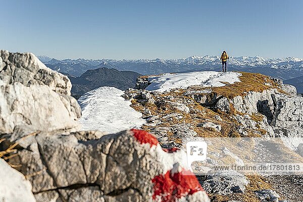 Mountaineer looks over snow-covered mountains  hiking to the Guffert  Brandenberg Alps  Tyrol  Austria  Europe