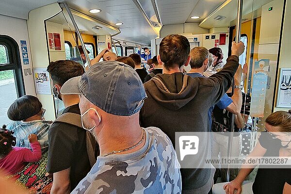 Very many people standing overcrowded in a local train  chaos in local traffic  9 euro ticket  Corona  Ruhr area  Germany  Europe