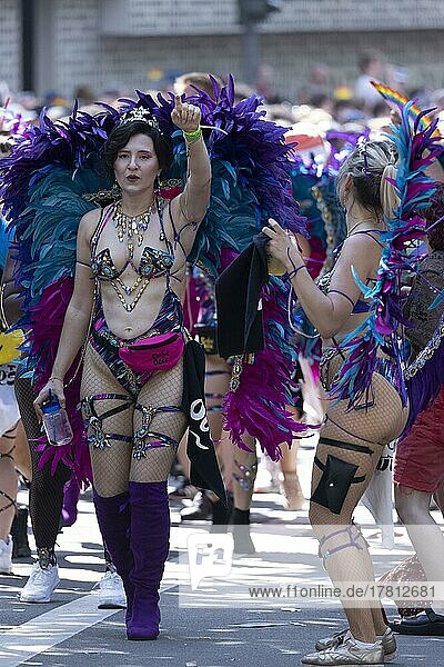Scantily clad woman with colourful wings walk in the CSD parade  Cologne  North Rhine-Westphalia  Germany  Europe